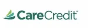 Logo of CareCredit featuring stylized green leaves next to the text "CareCredit.