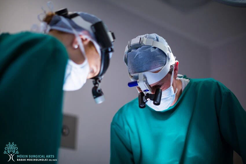 Two surgeons working in an operating room.